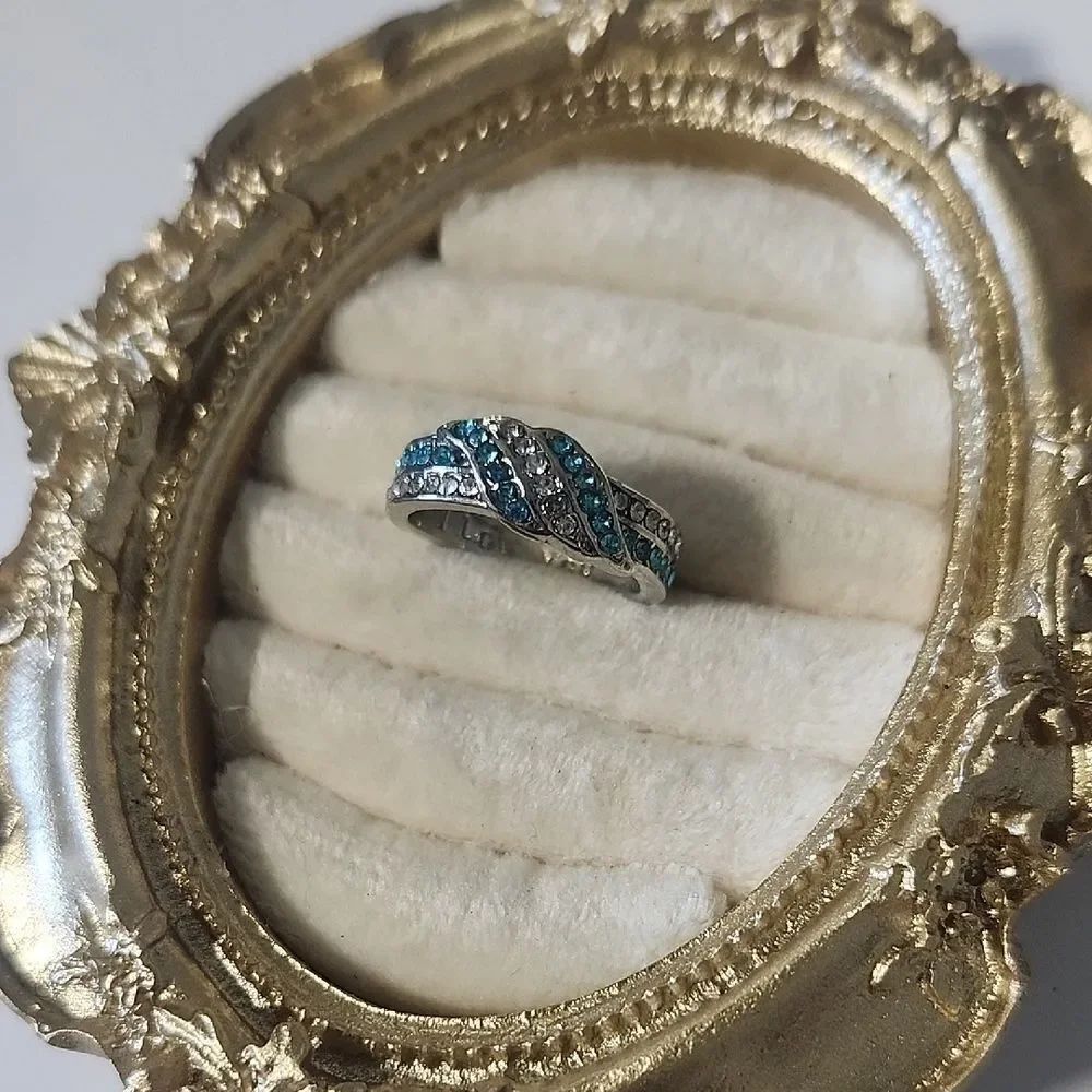 Ring. Silver Tone Blue & Clear Love Knot Crystals "I Love You" engraved.  Sz 6